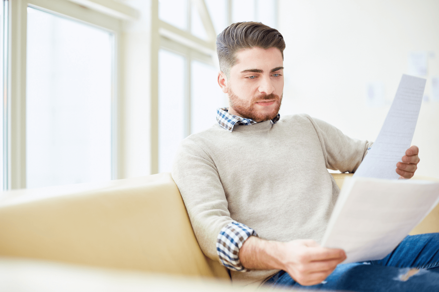 Homebuyer reviewing mortgage pre-approval paperwork