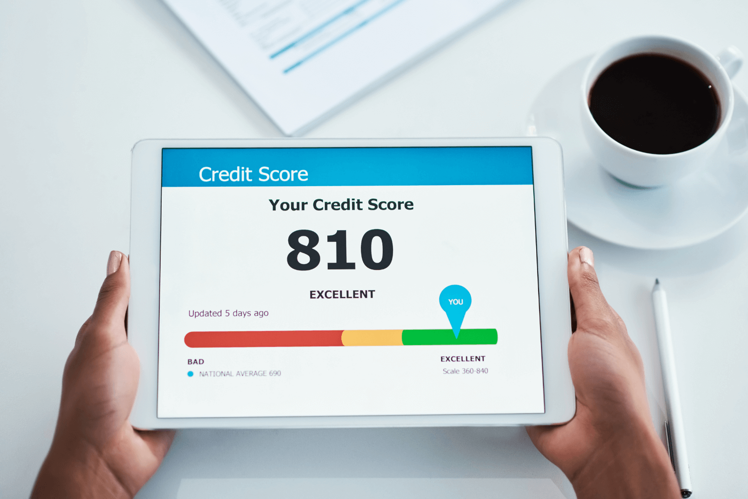 Person viewing their credit score on a digital screen