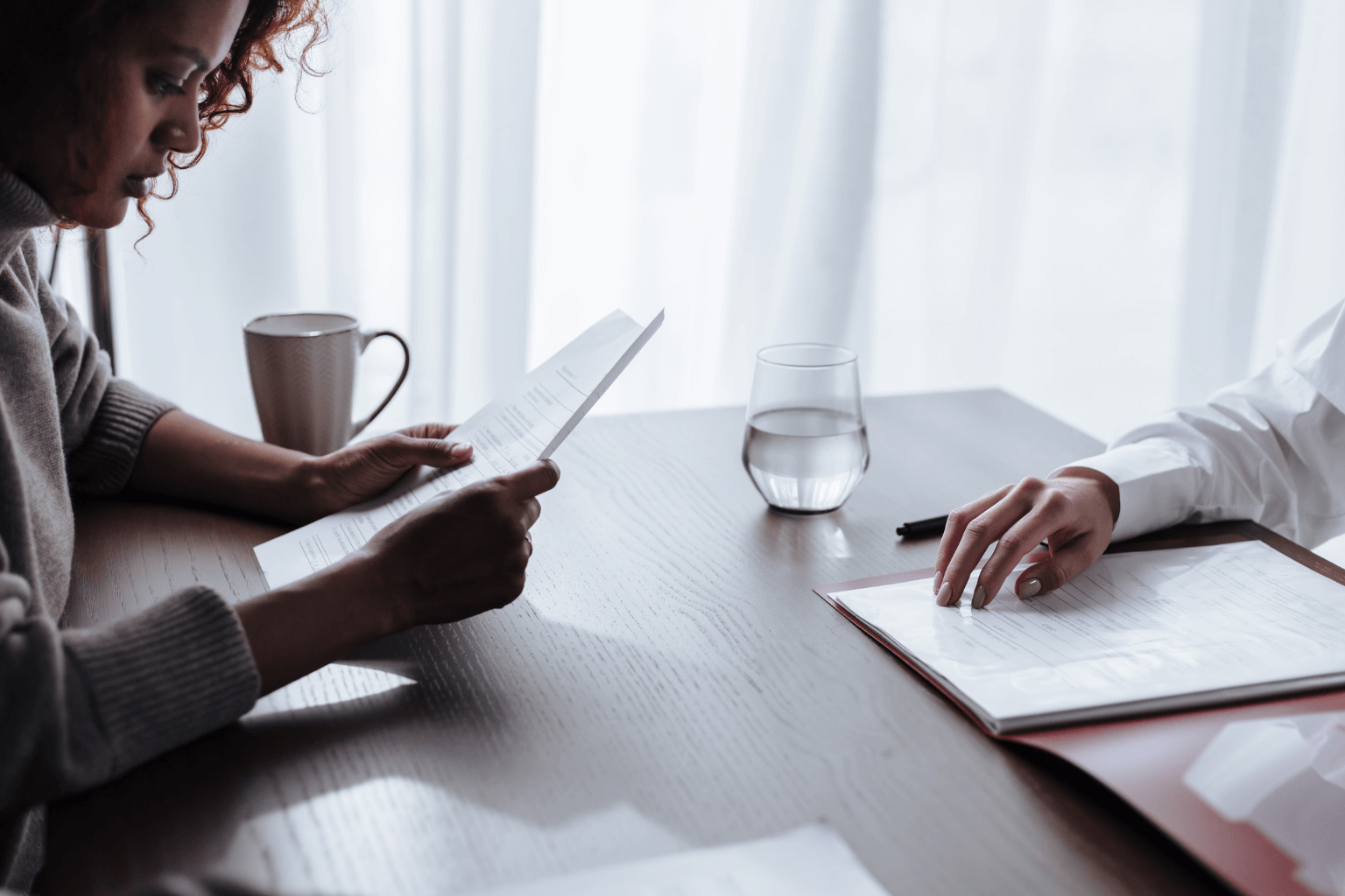 Homebuyer reviewing options with a real estate agent