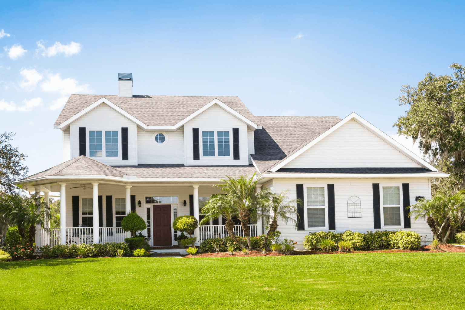 Staged home exterior in Clayton with tidy landscaping and welcoming entrance