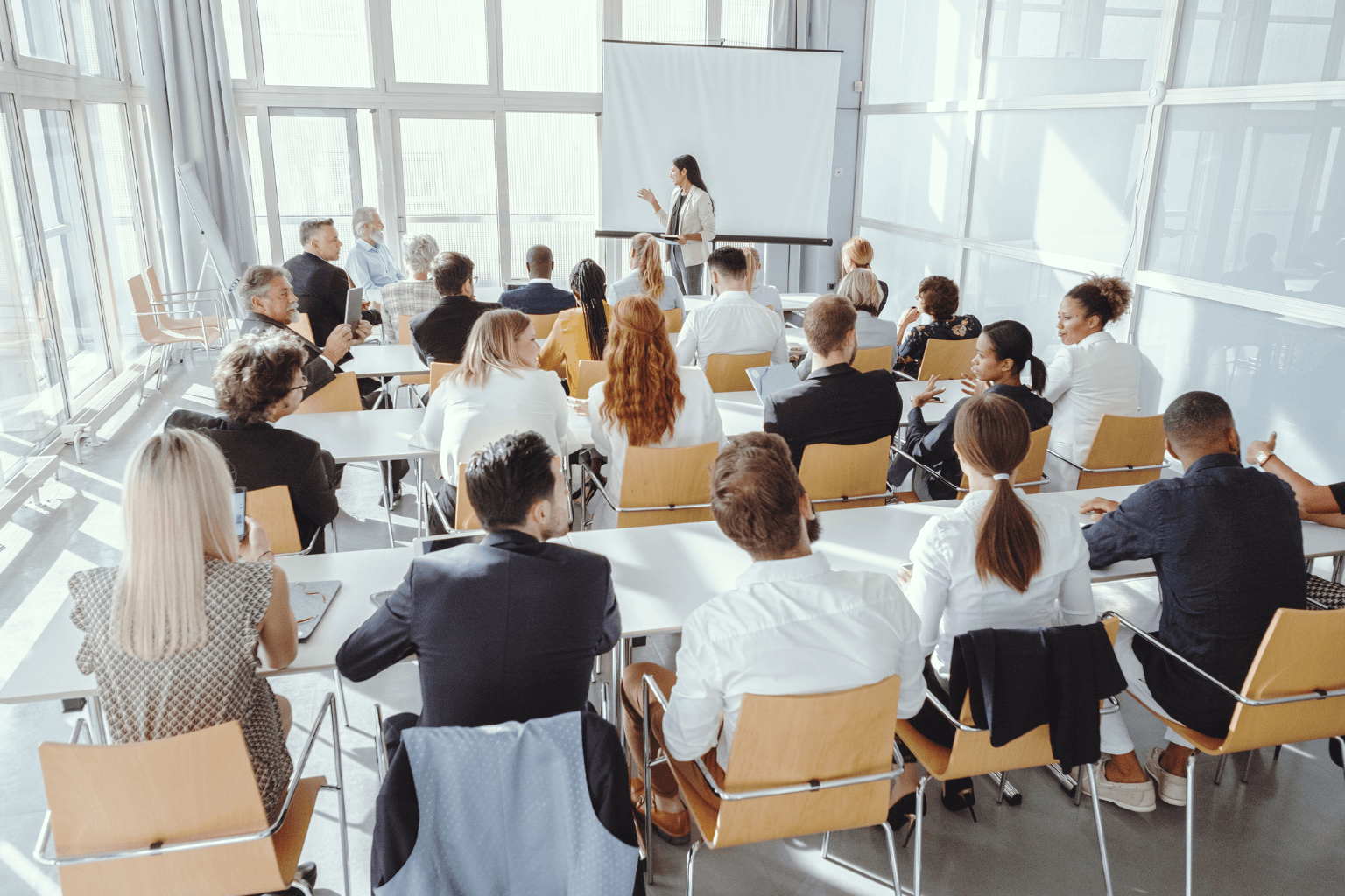 Small group of people attending a local real estate seminar or webinar