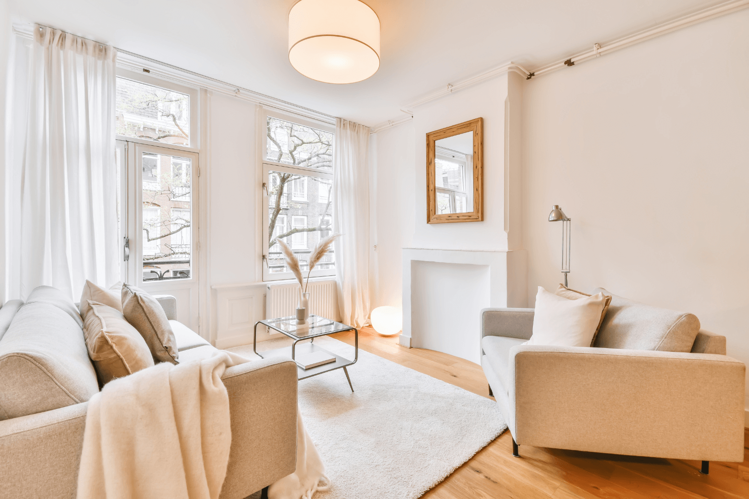 Neat and decluttered living room with neutral furniture