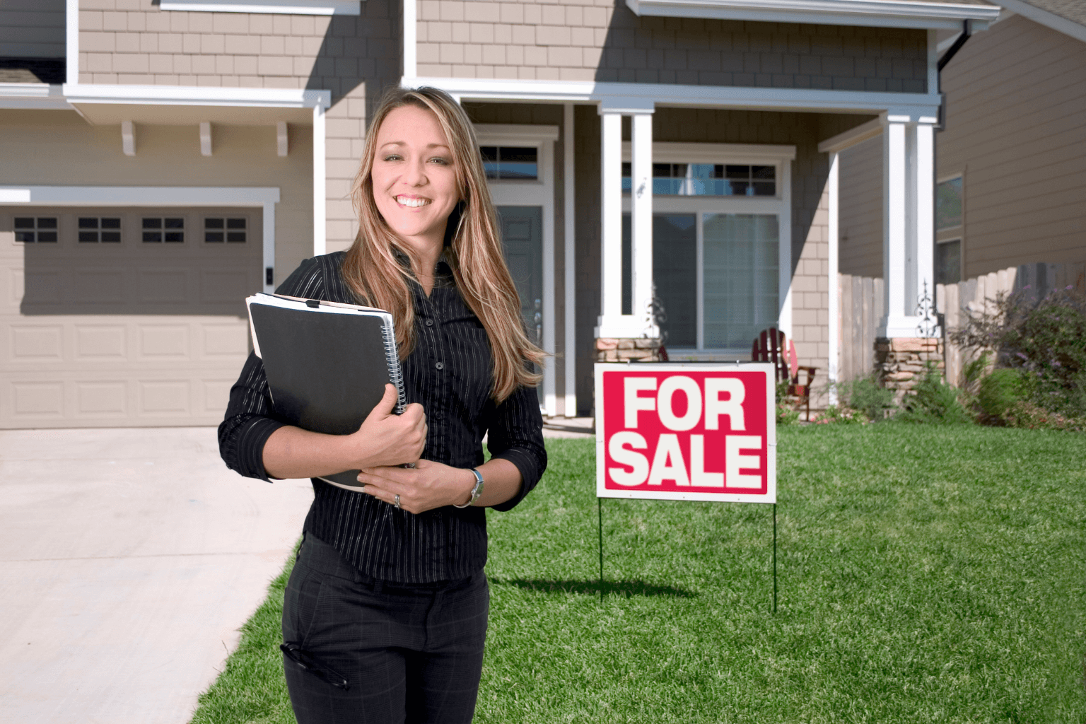 A professional Dublin realtor walking outside modern homes