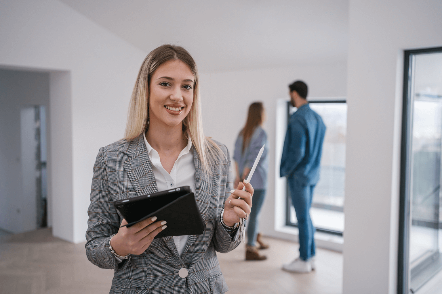 Experienced real estate agent standing inside a home.
