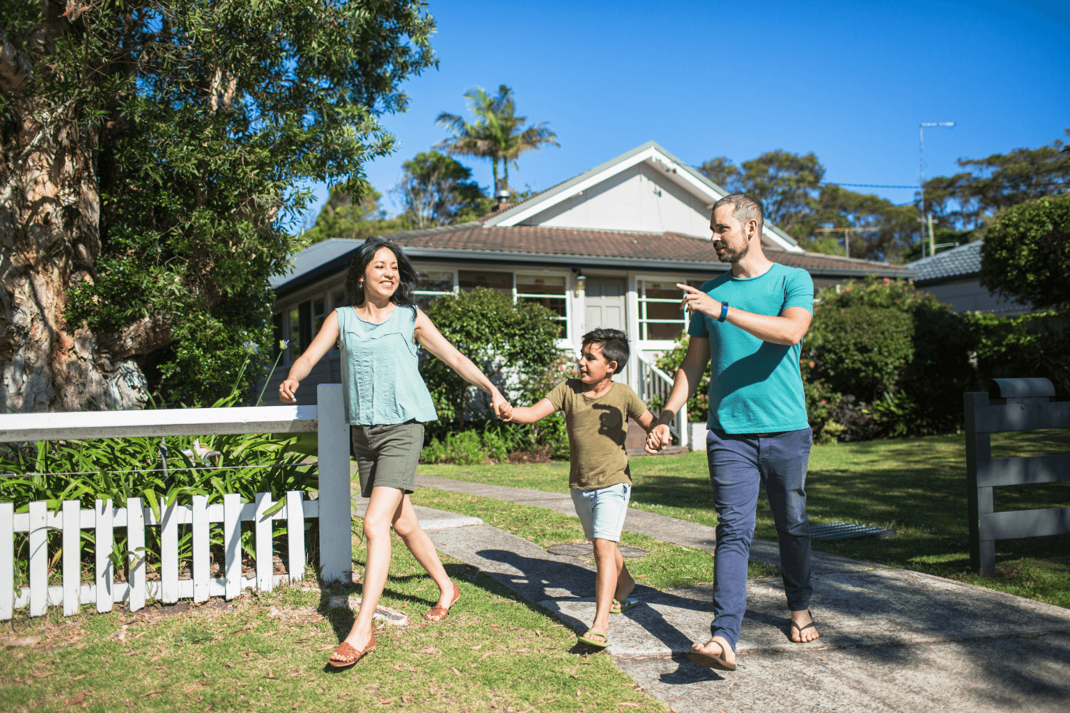 Family walking in a Moraga neighborhood with greenery