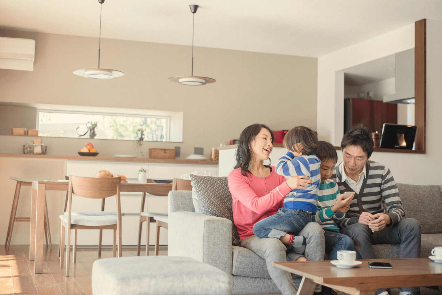 Family enjoying living room comfort in energy-efficient California home