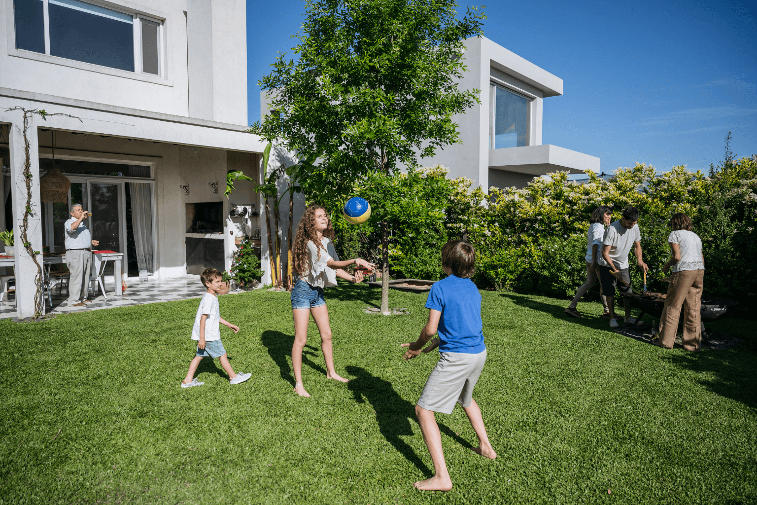 people relaxing on a golf course community patio or backyard