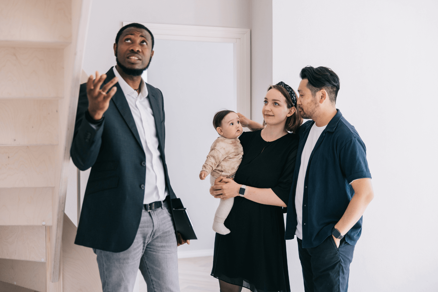 Smiling family visiting a home for sale