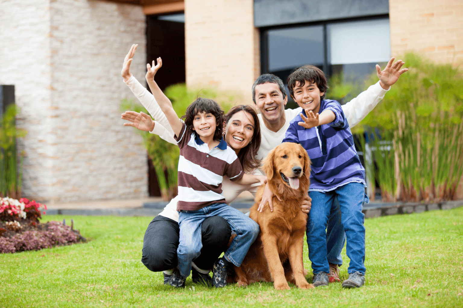 Happy family standing in front of a shome in Walnut Creek