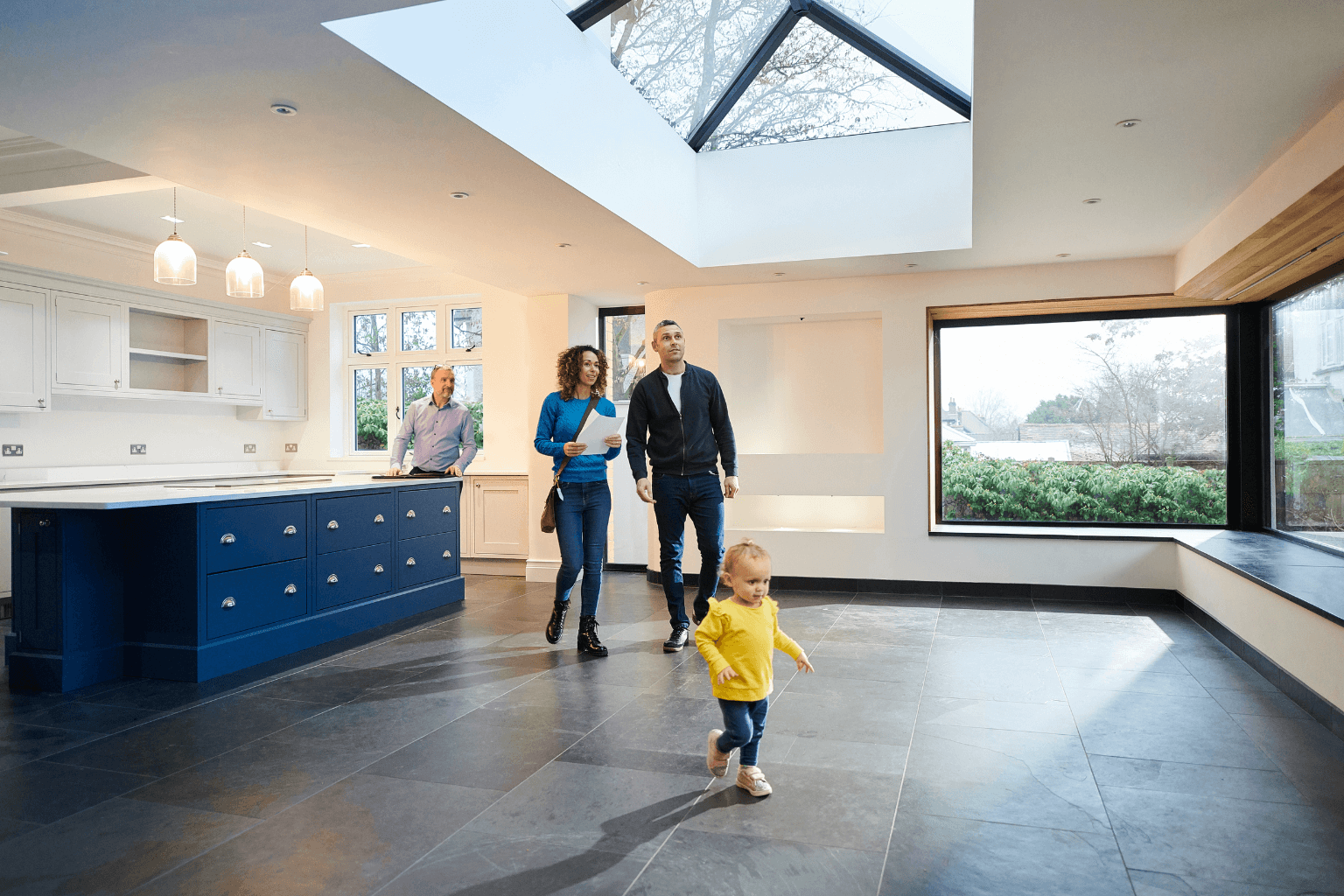 Family touring a home for sale in California