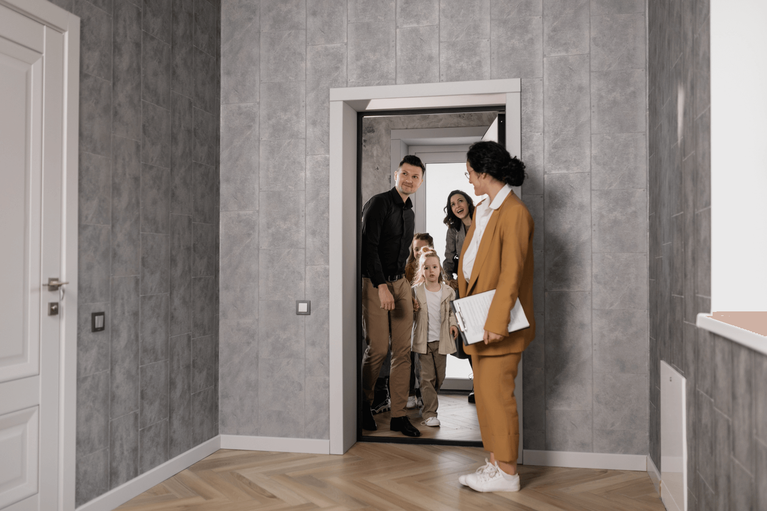 Realtor opening a front door for a house tourRealtor opening a front door for a house tour