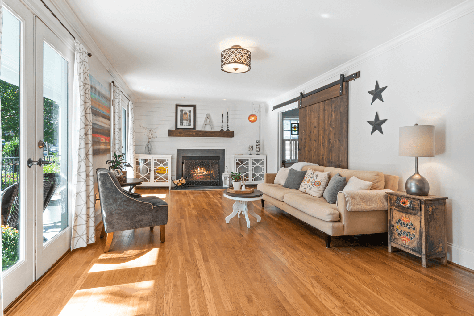 Bright and neutral staged living room with modern furniture