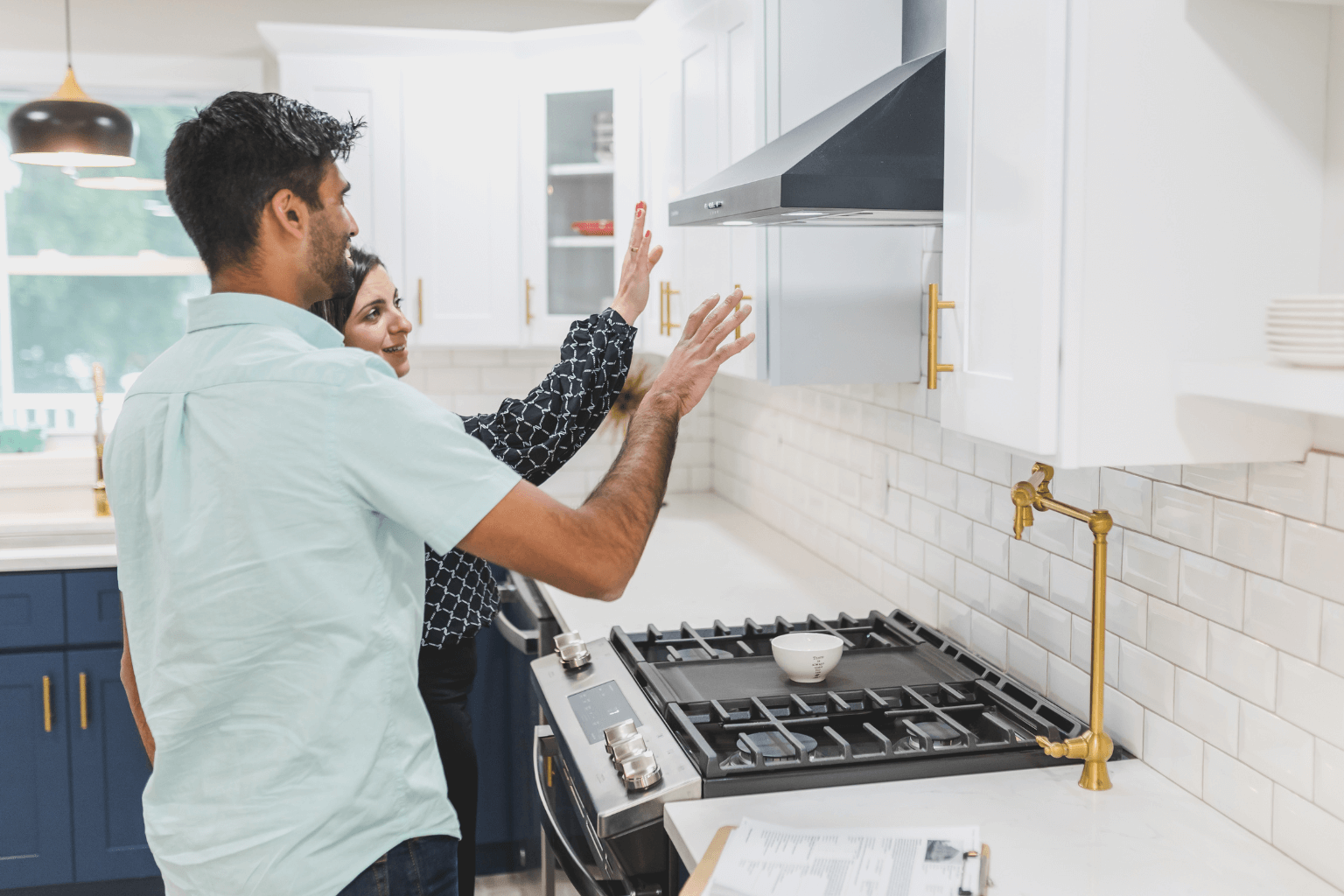 Person inspecting home interior, checking kitchen and layout