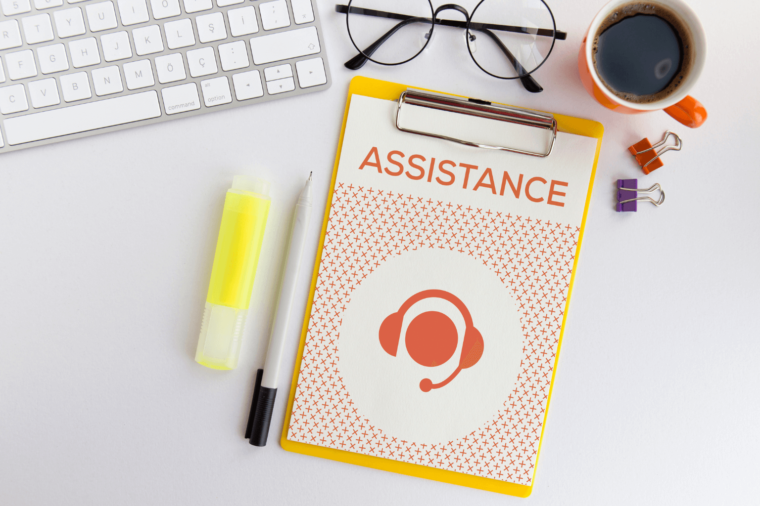 Paper labeled assistance on a table, representing housing support resources