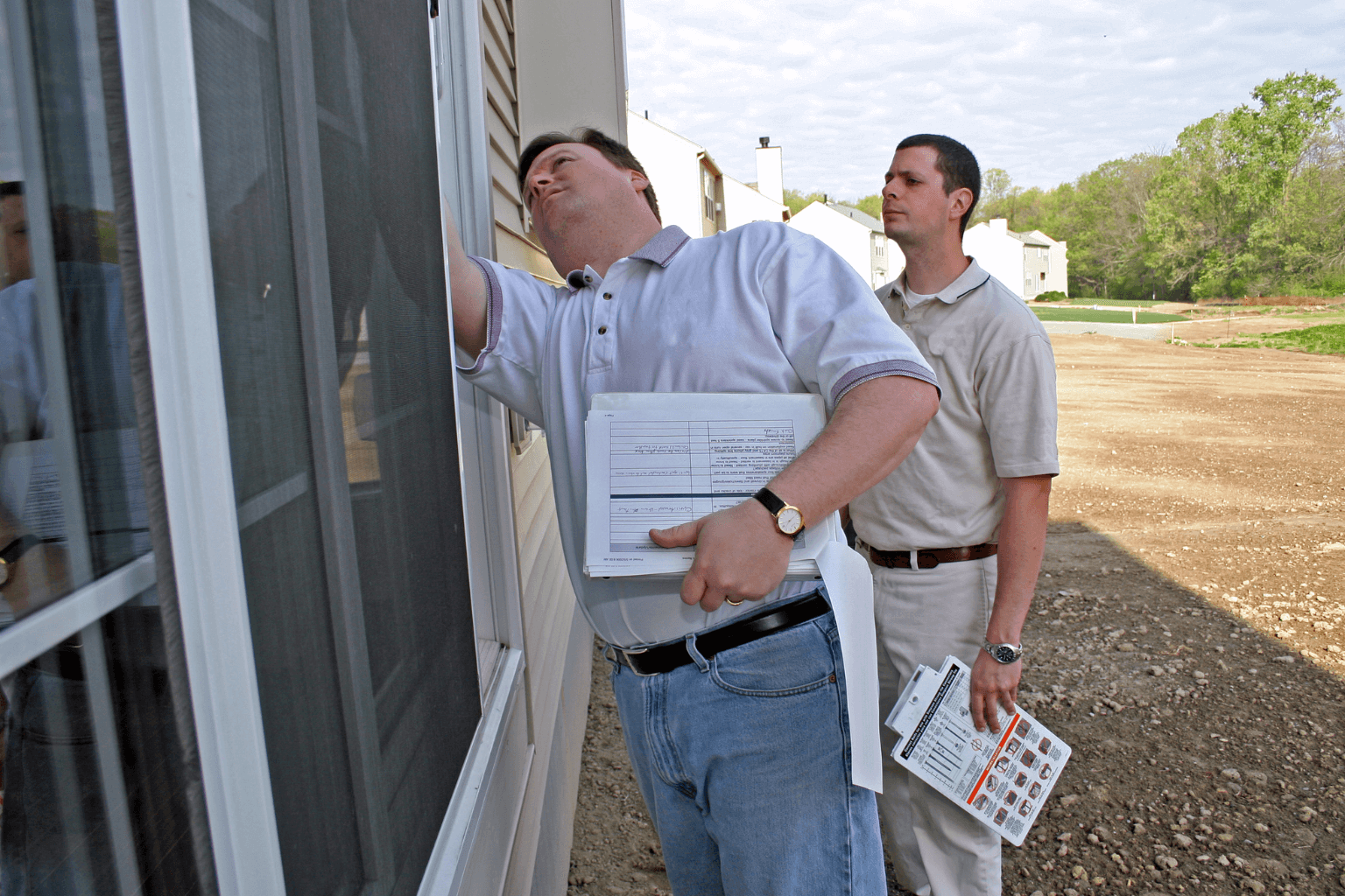 Inspector examining home systems during property evaluation