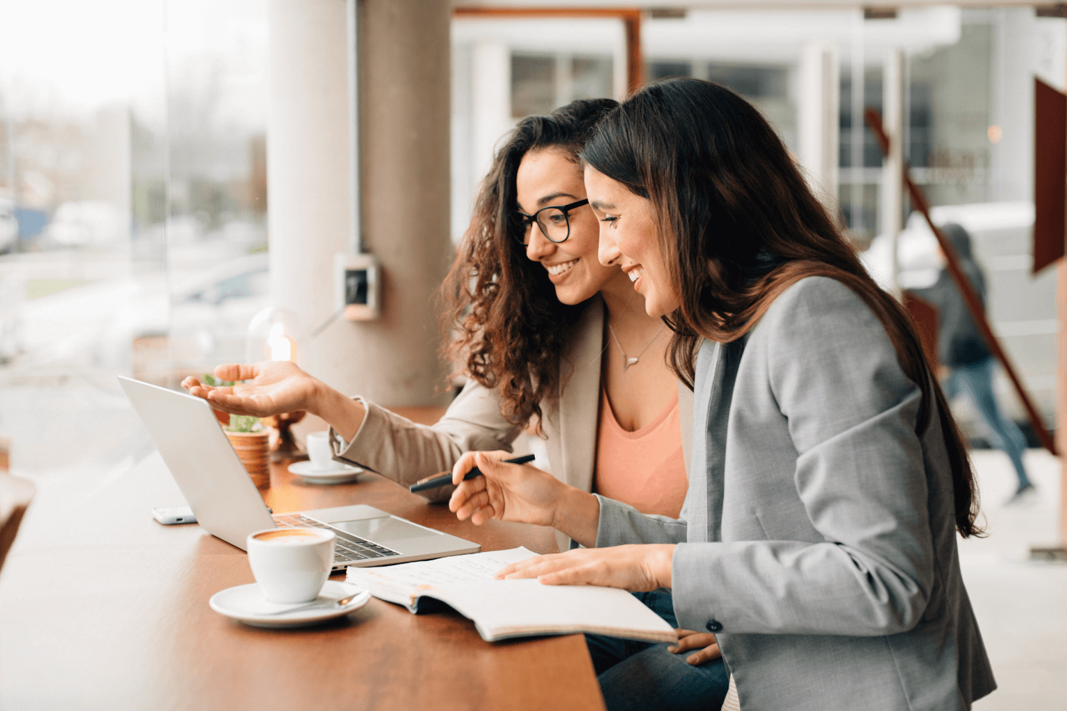 Realtor chatting with a client in a local coffee shop