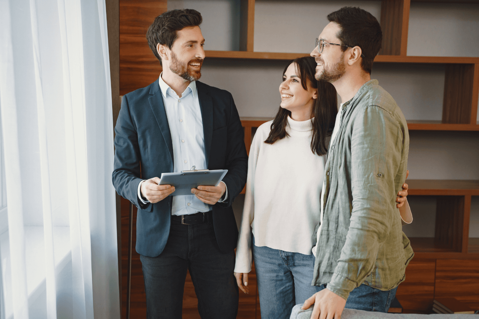 Real estate agent talking to a couple in Moraga, California