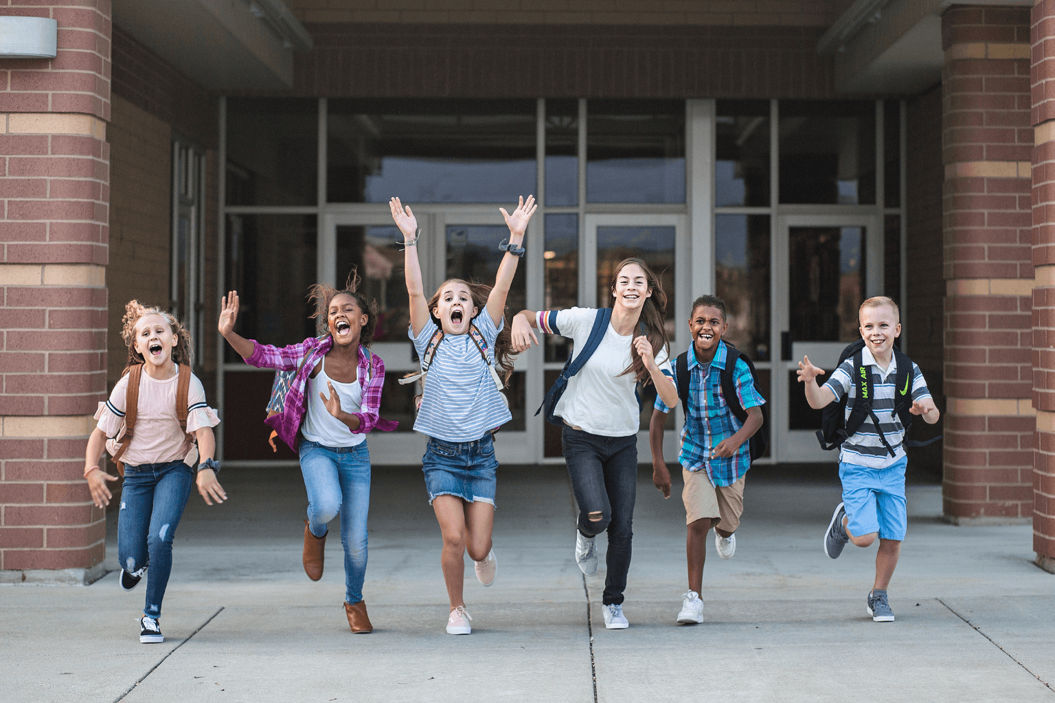 Public school building in Moraga CA with students walking outside