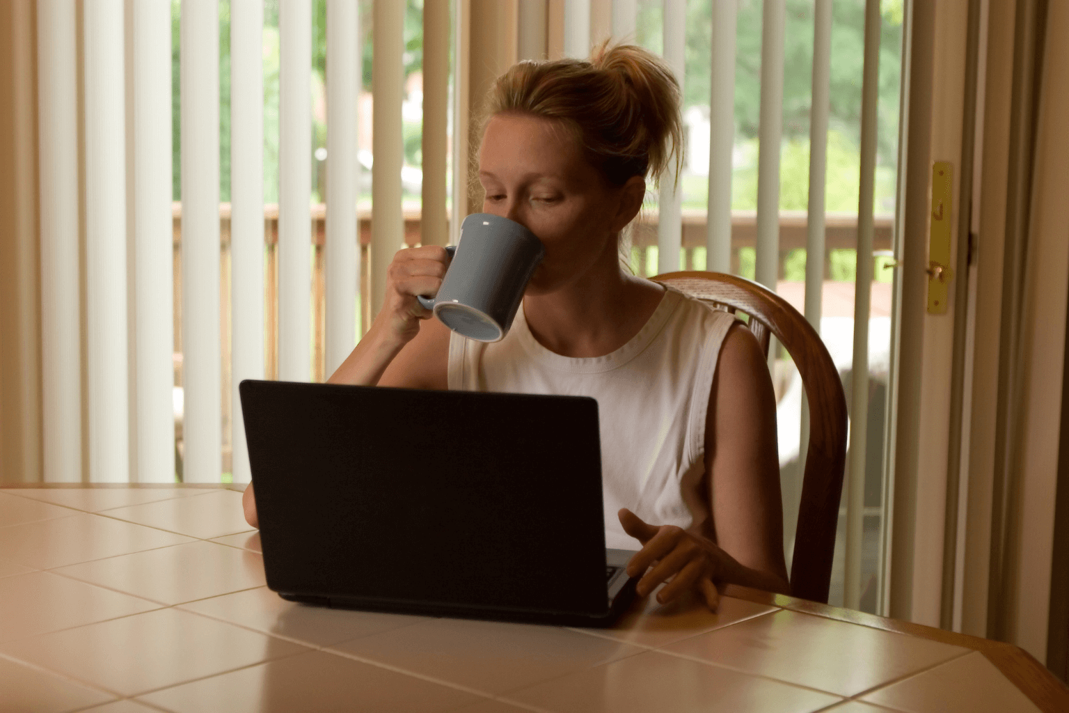 Realtor drinking morning coffee while checking schedule