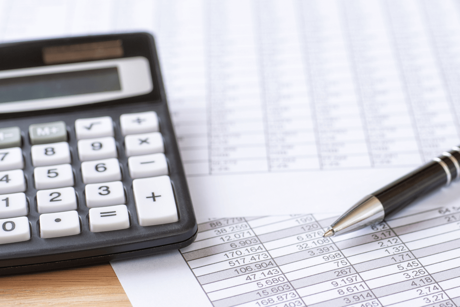financial documents with a calculator