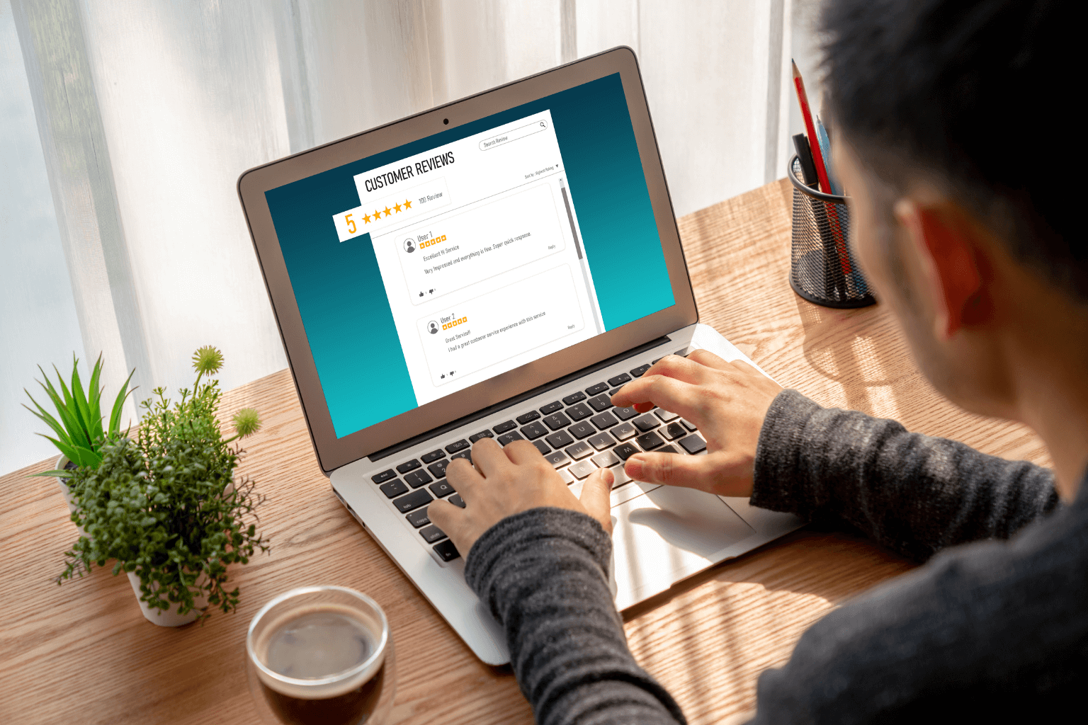Laptop screen displaying five-star reviews for real estate agents