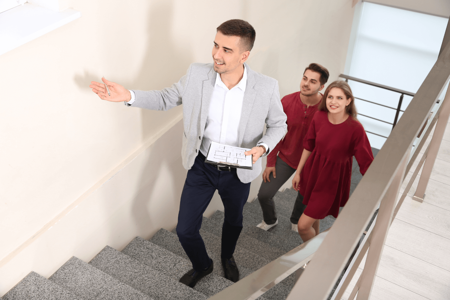 Real estate agent showing a home to clients