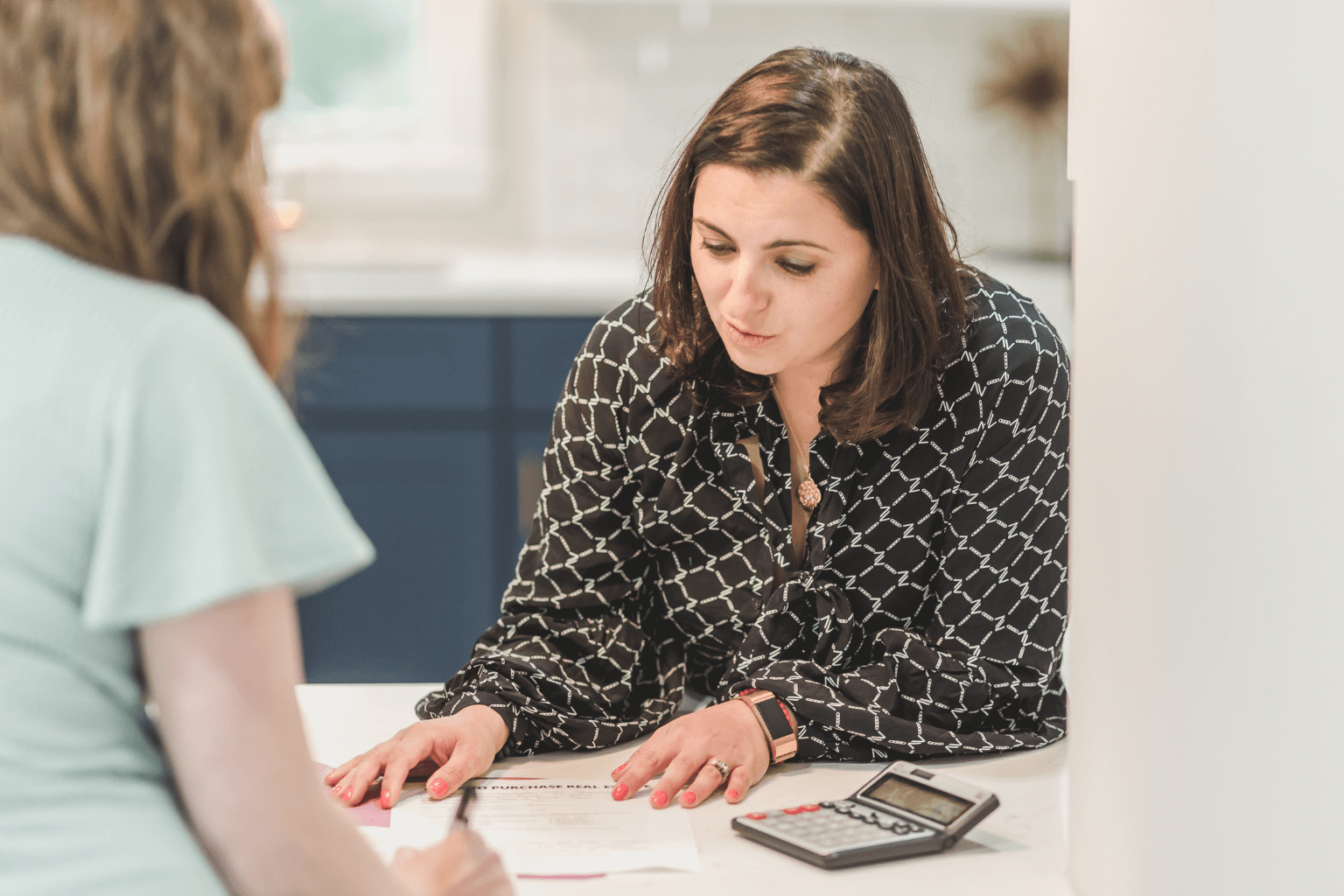 Real estate agent talking to a first-time homebuyer couple