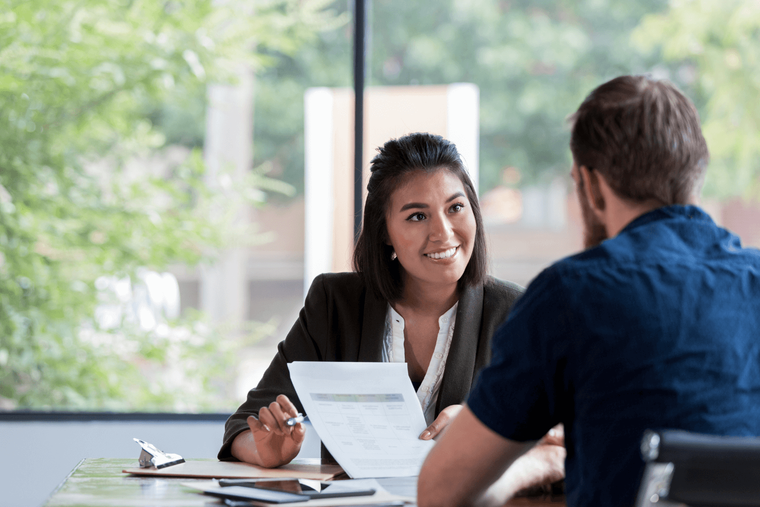 Realtor discussing home pricing strategy with seller