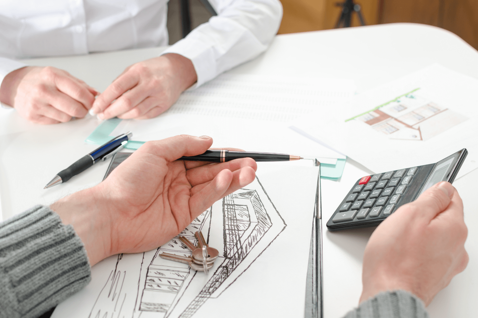 Real estate agent showing pricing information