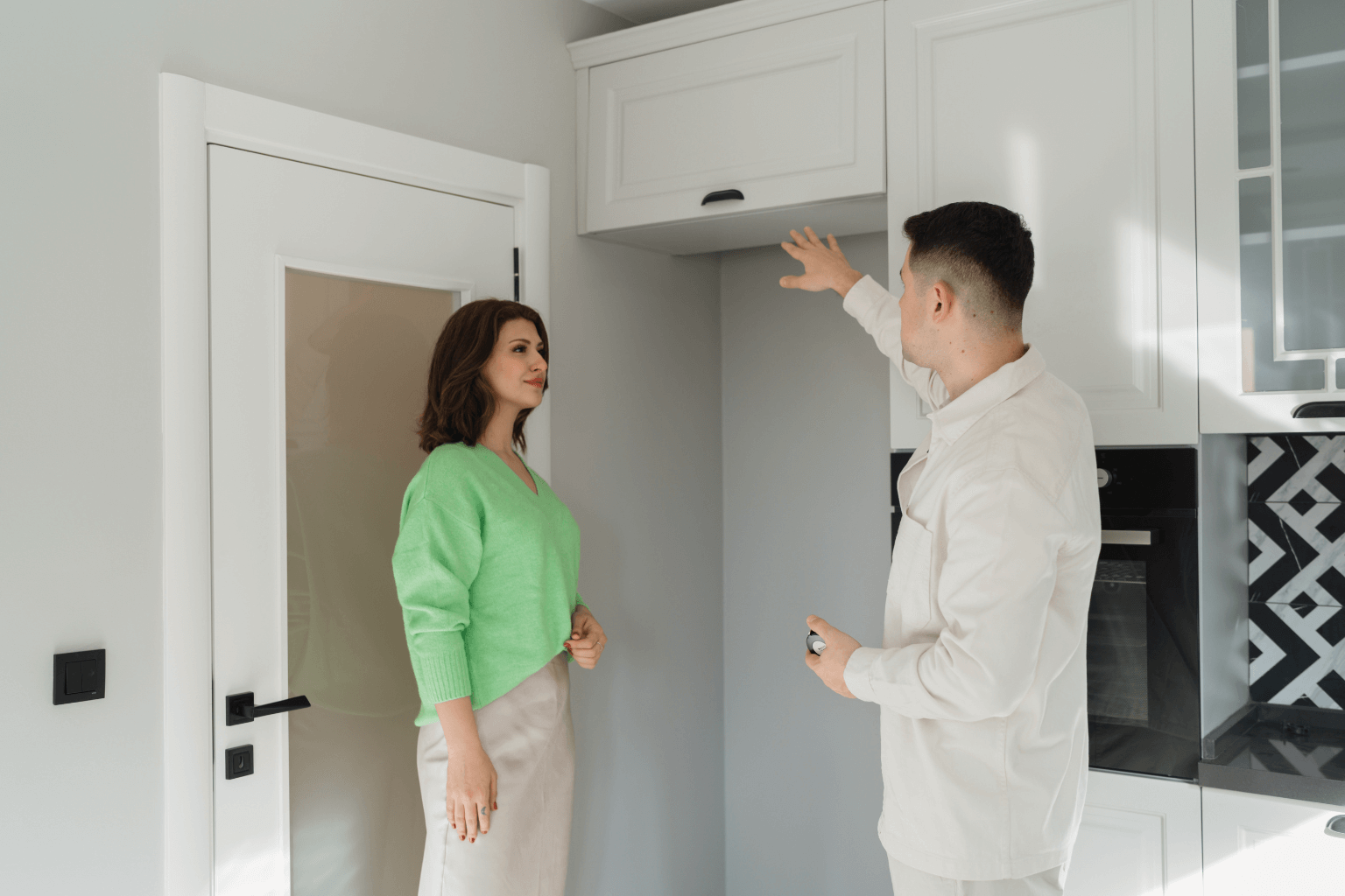 Real estate agent smiling while showing house