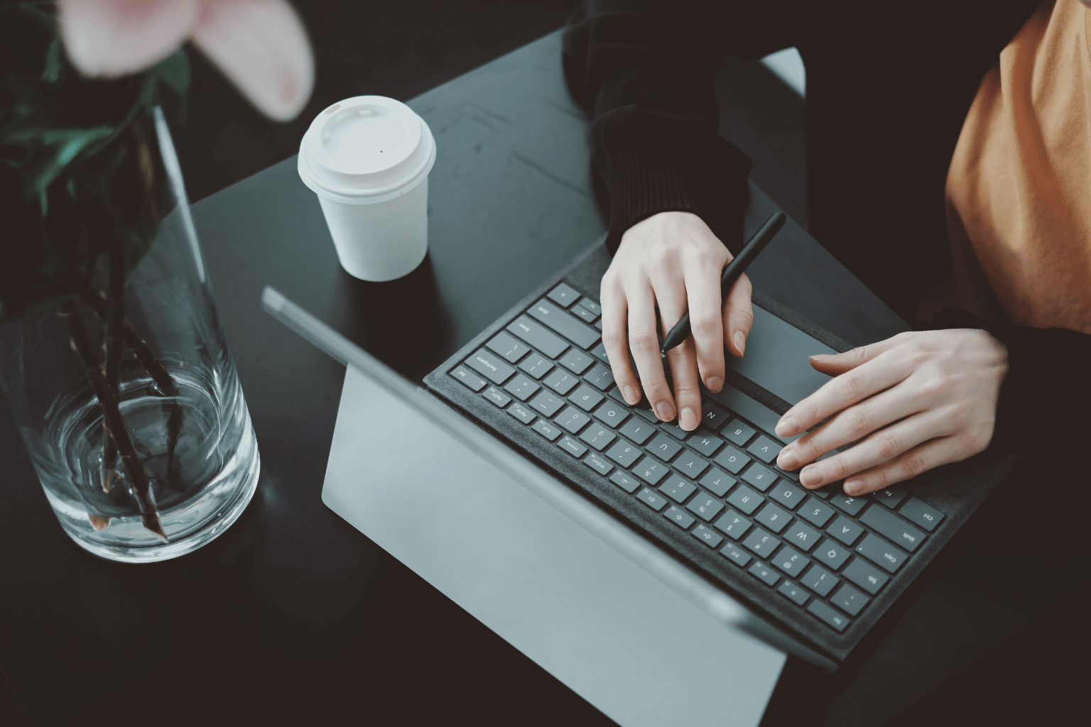 Real estate agent planning ad strategy on a laptop