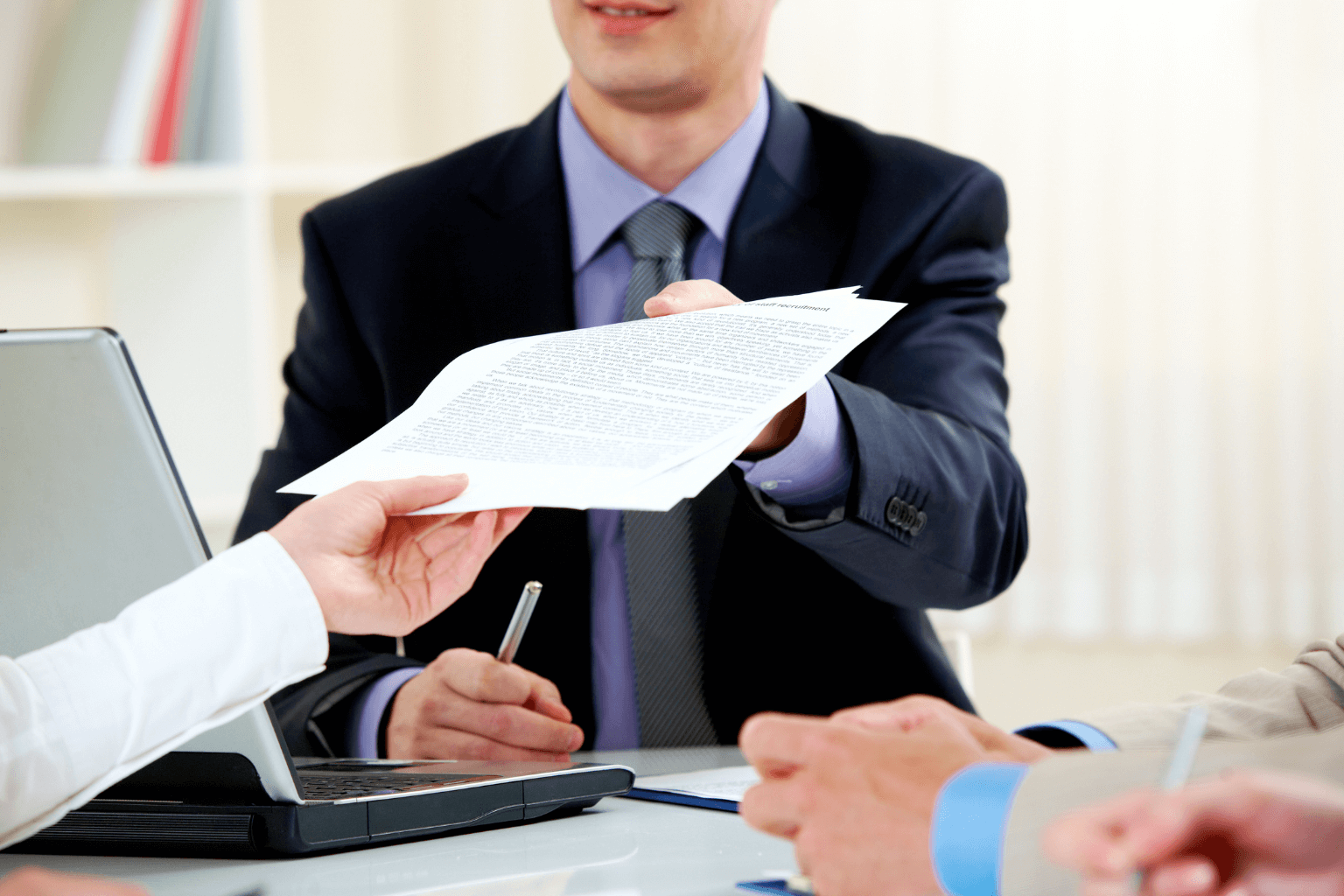 Real estate agent showing property details to home buyers