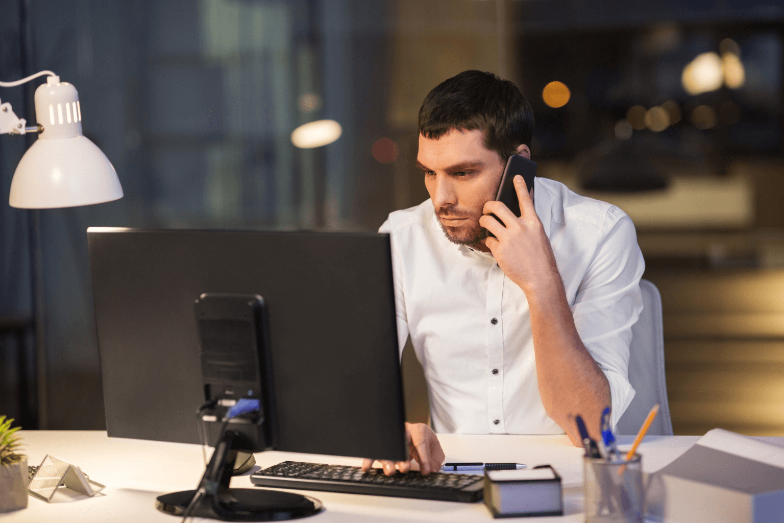 Realtor making evening phone calls and organizing documents
