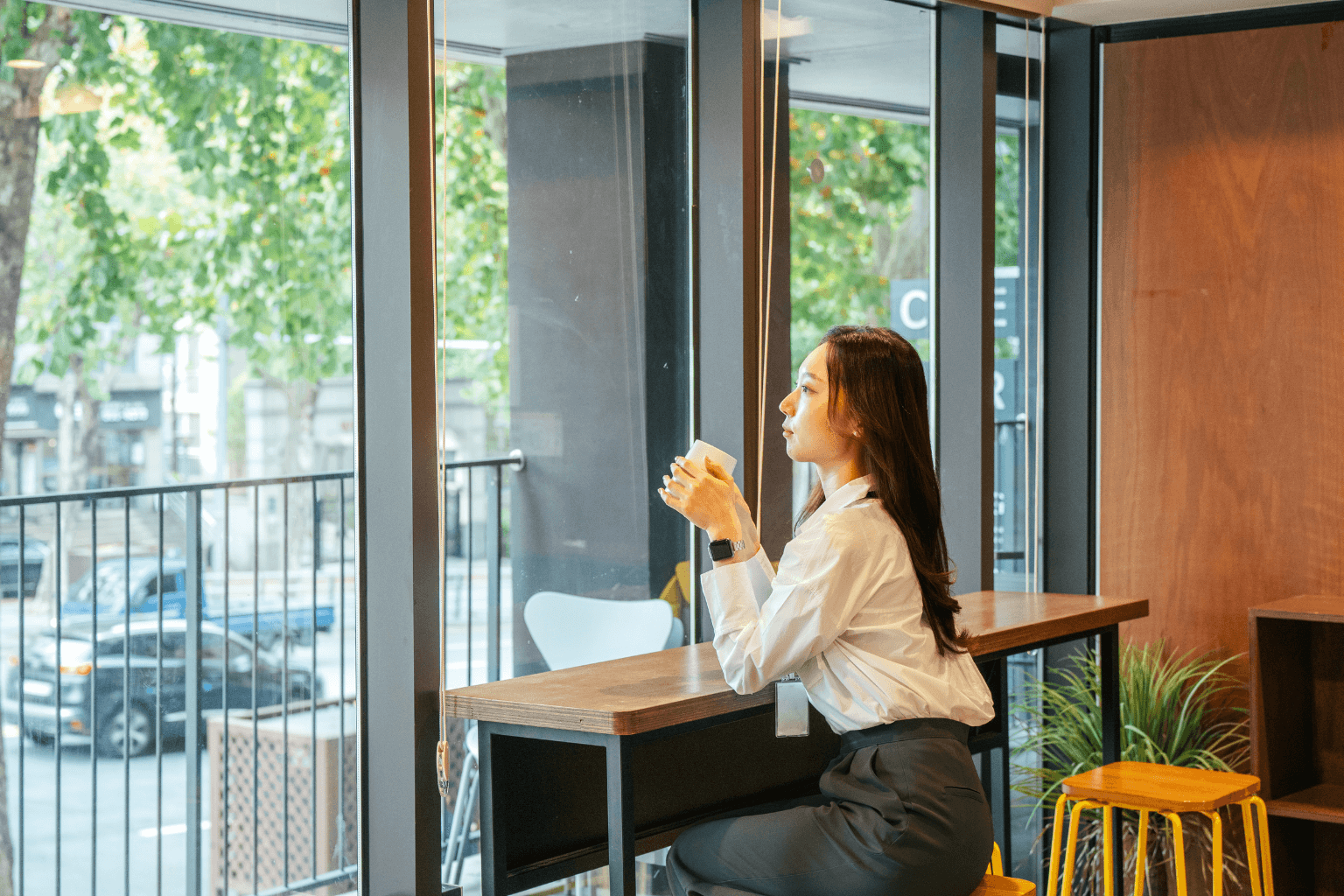 Real estate agent relaxing in a coffee shop during a break