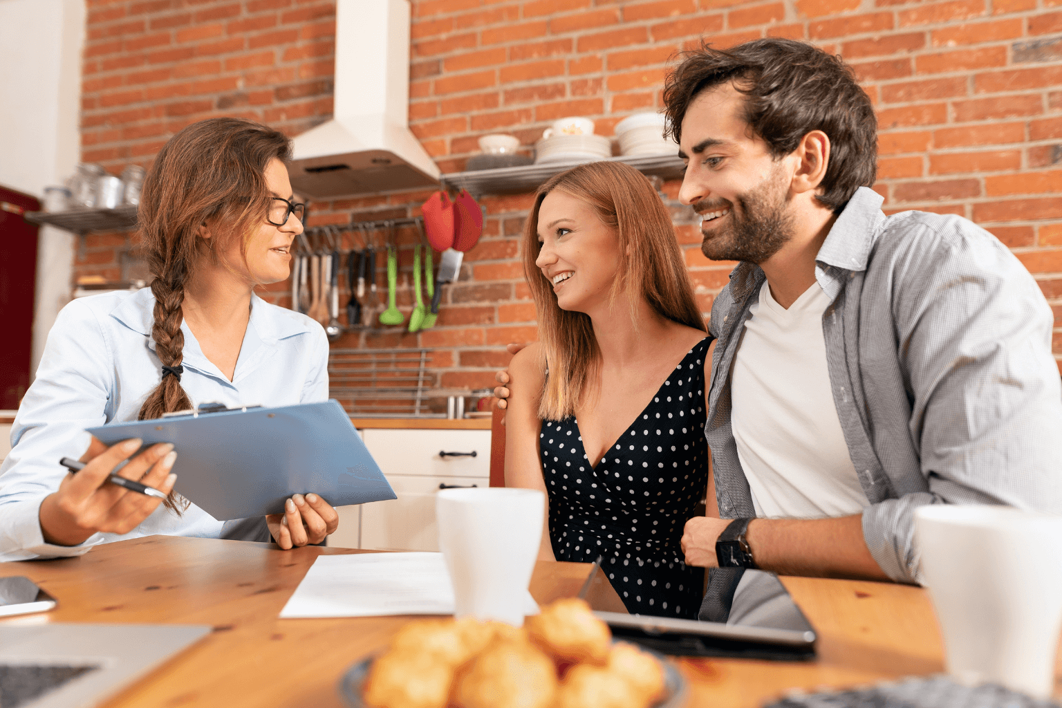 Realtor discussing a home with a couple