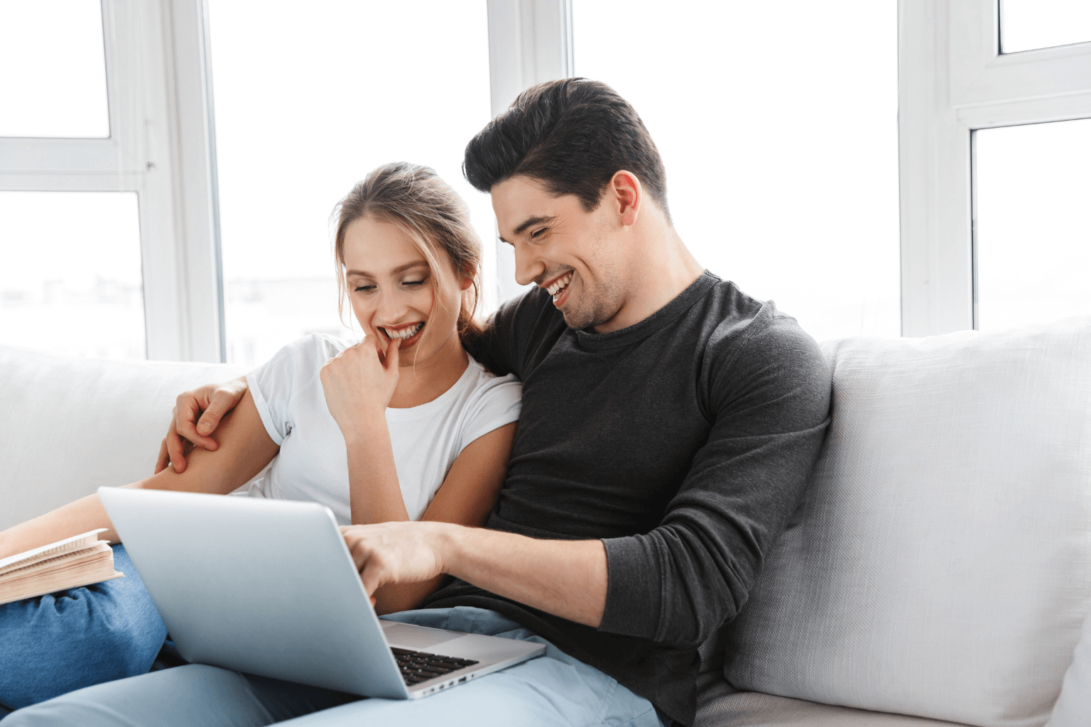 Couple searching for homes in Dublin CA on a real estate website
