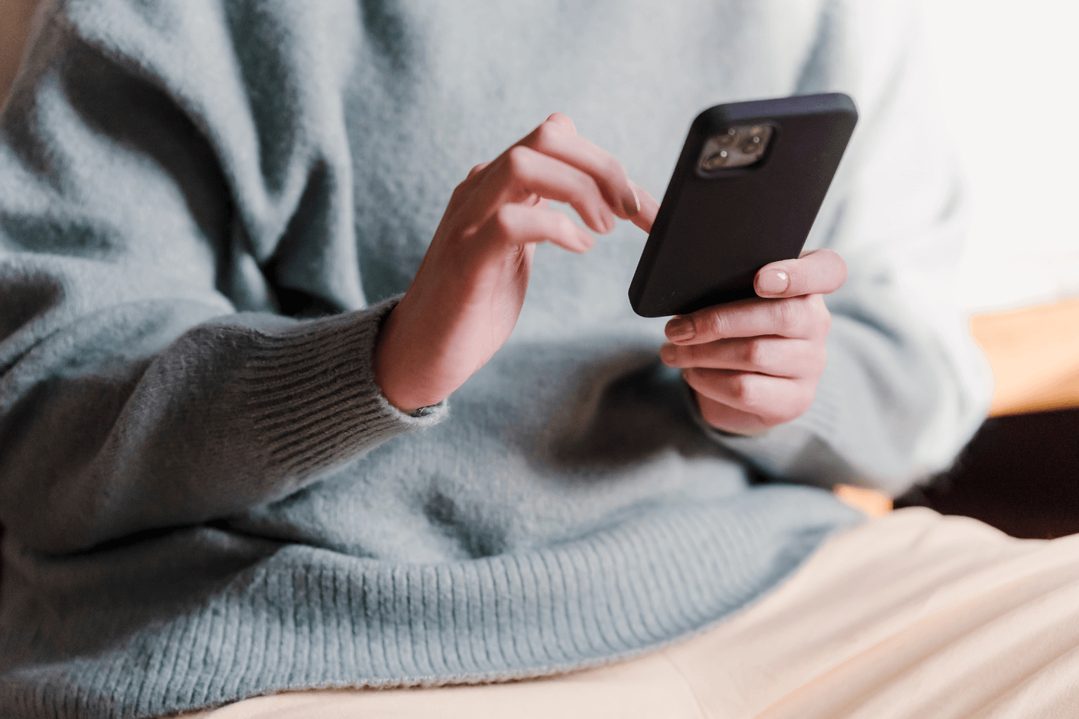 Using phone for social media engagement.
