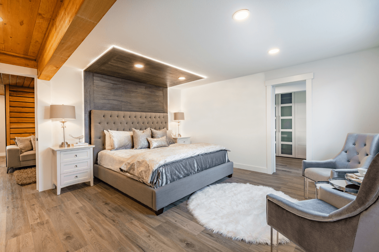 Cozy staged bedroom with soft lighting and neutral bedding