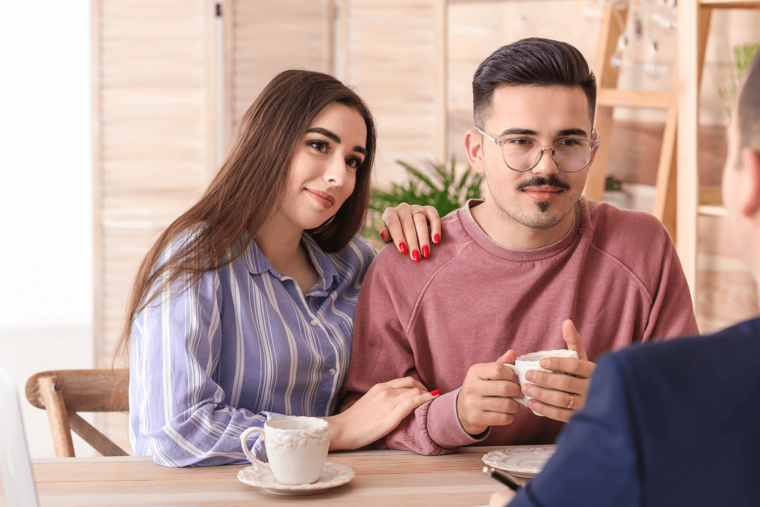 Home buyers meeting with a real estate agent in California