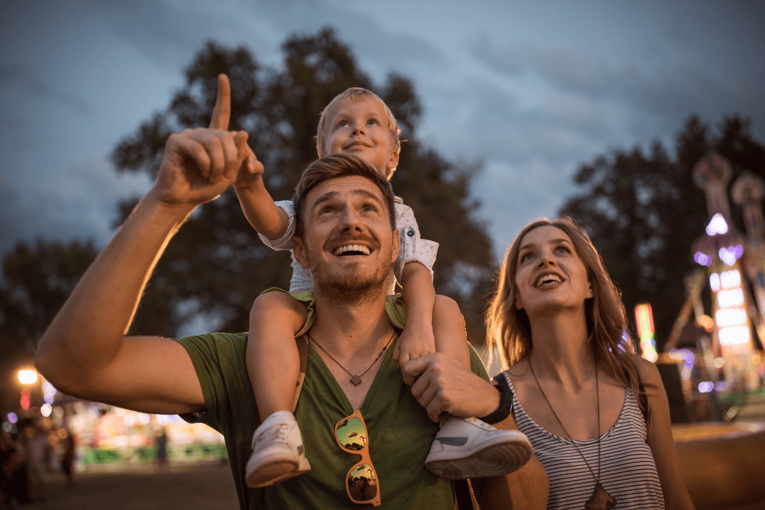 a family enjoying a small-town outdoor festival