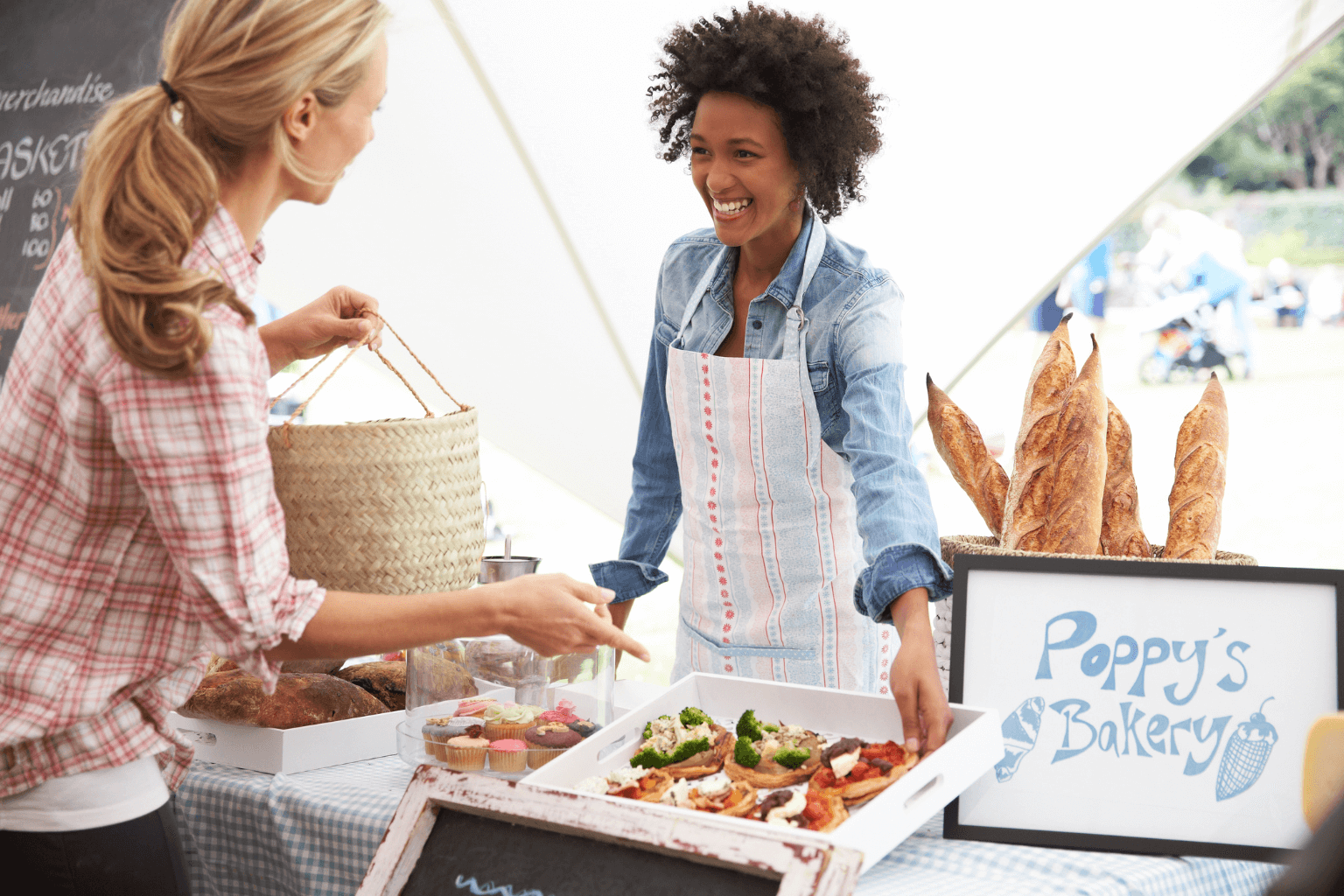 a woman buying at a local food stall
