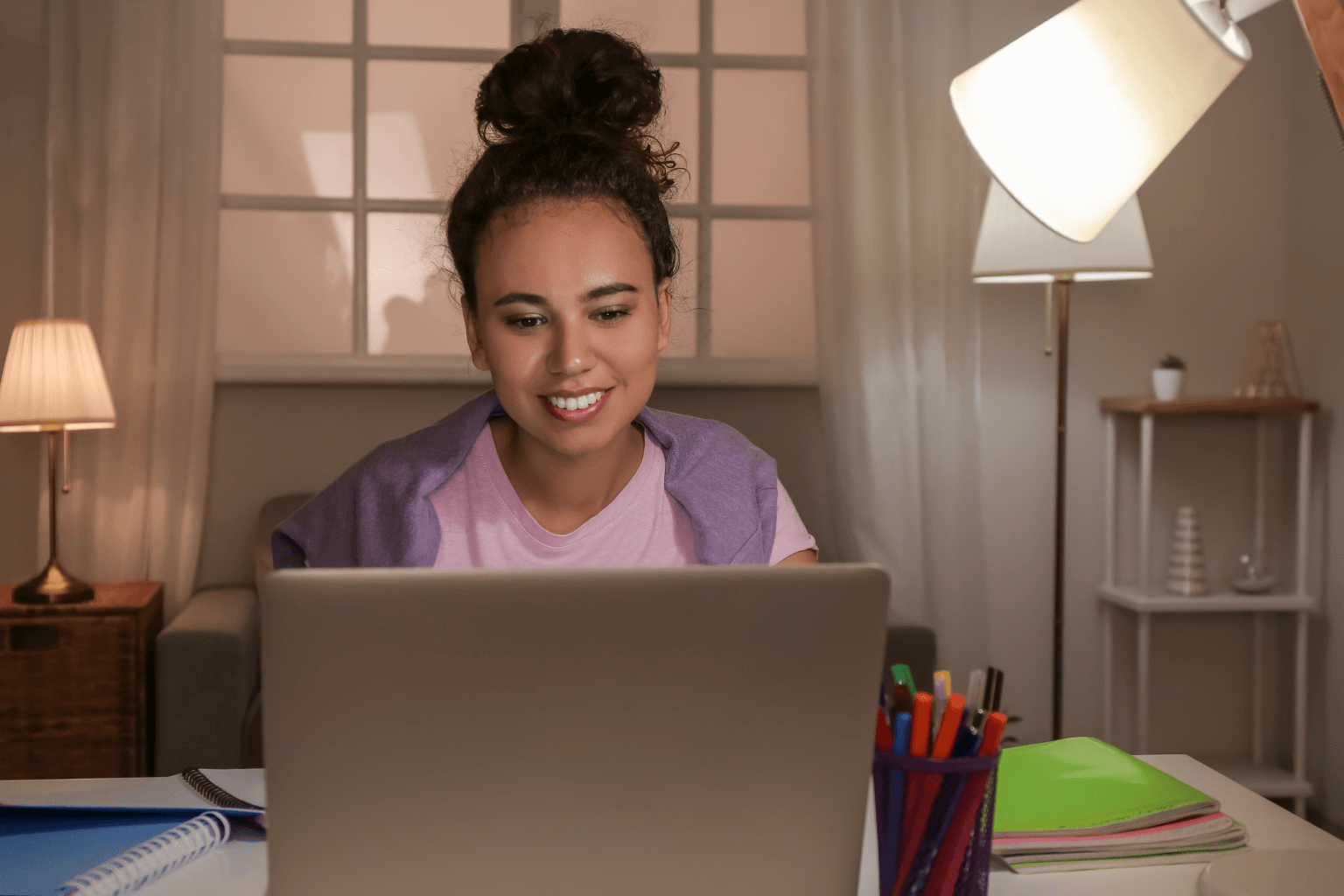 Realtor updating marketing and social media in the evening.