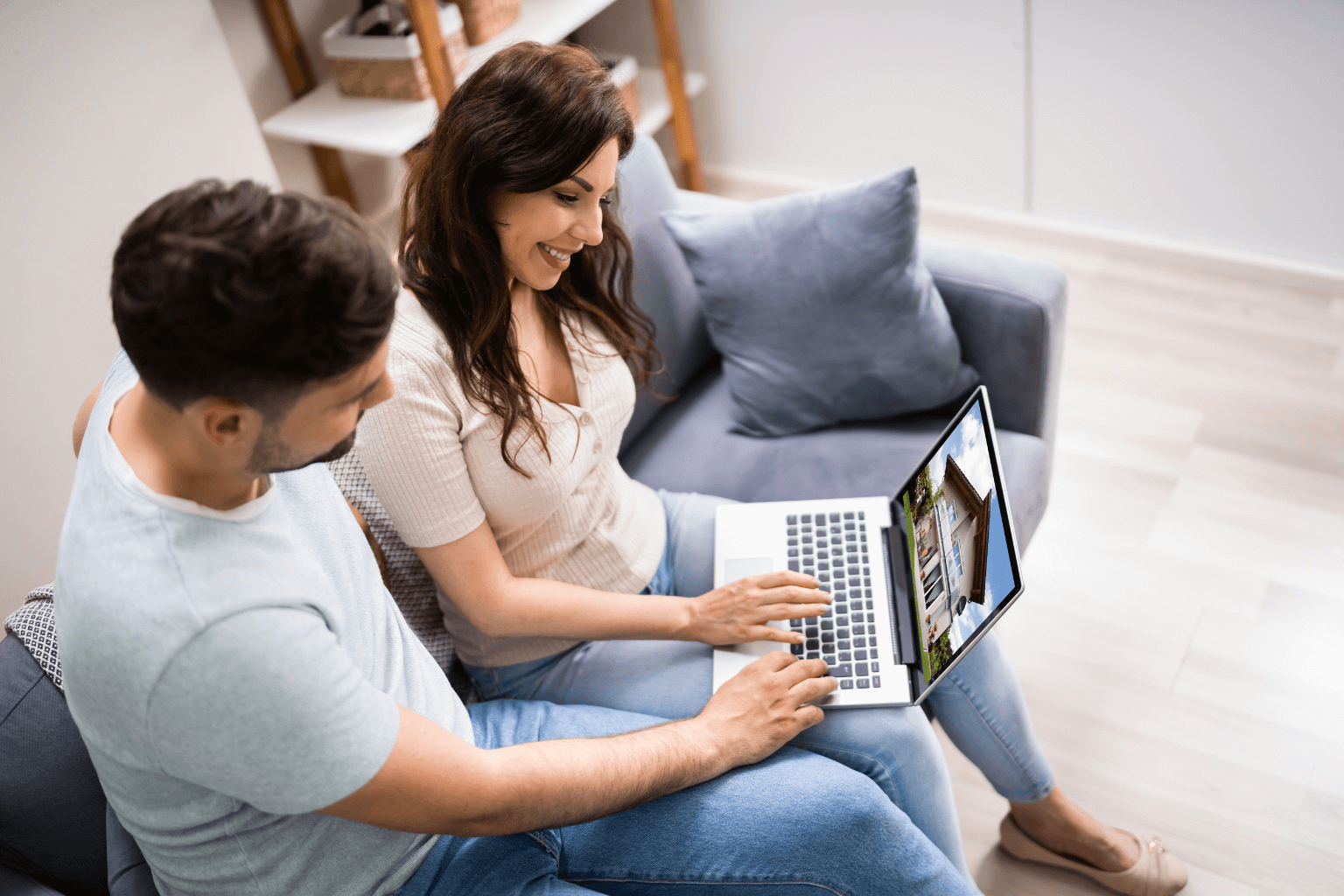 Couple researching real estate agents and homes online