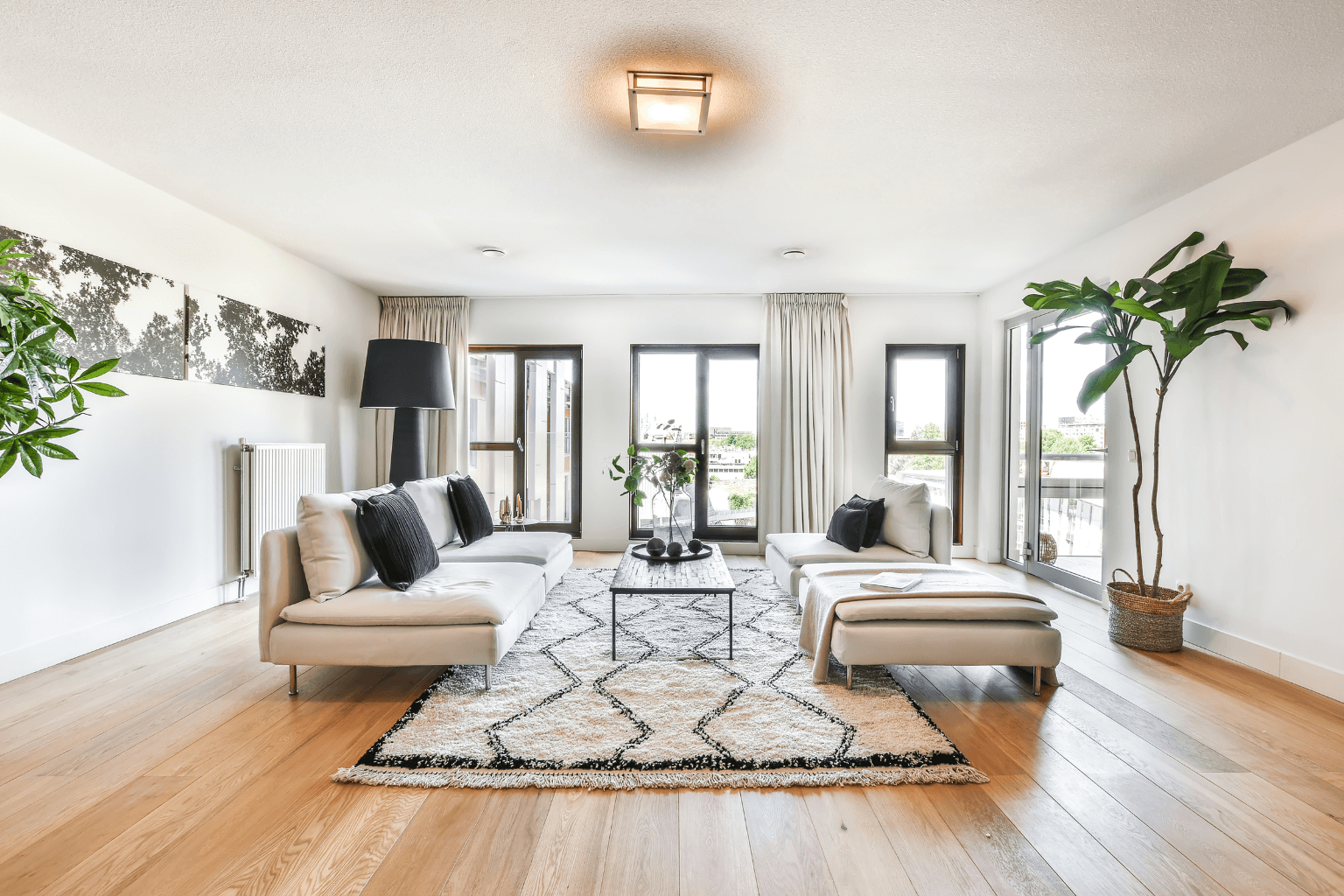 A staged living room with clean and modern furniture.