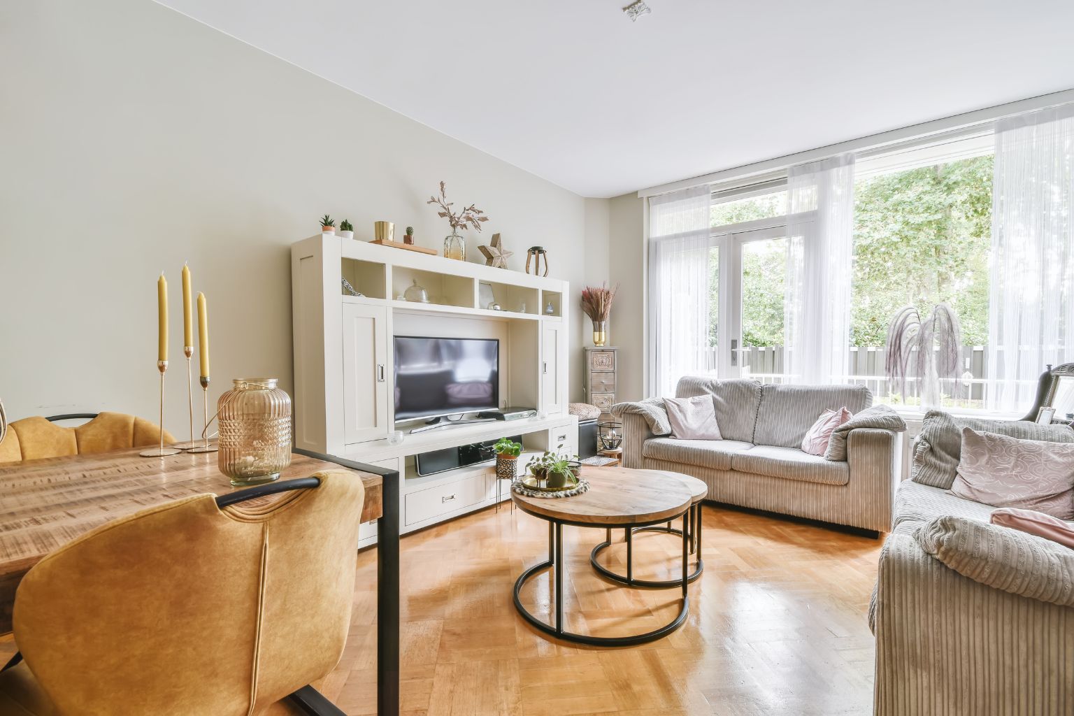 Neutral living room with light colors and simple staging decor