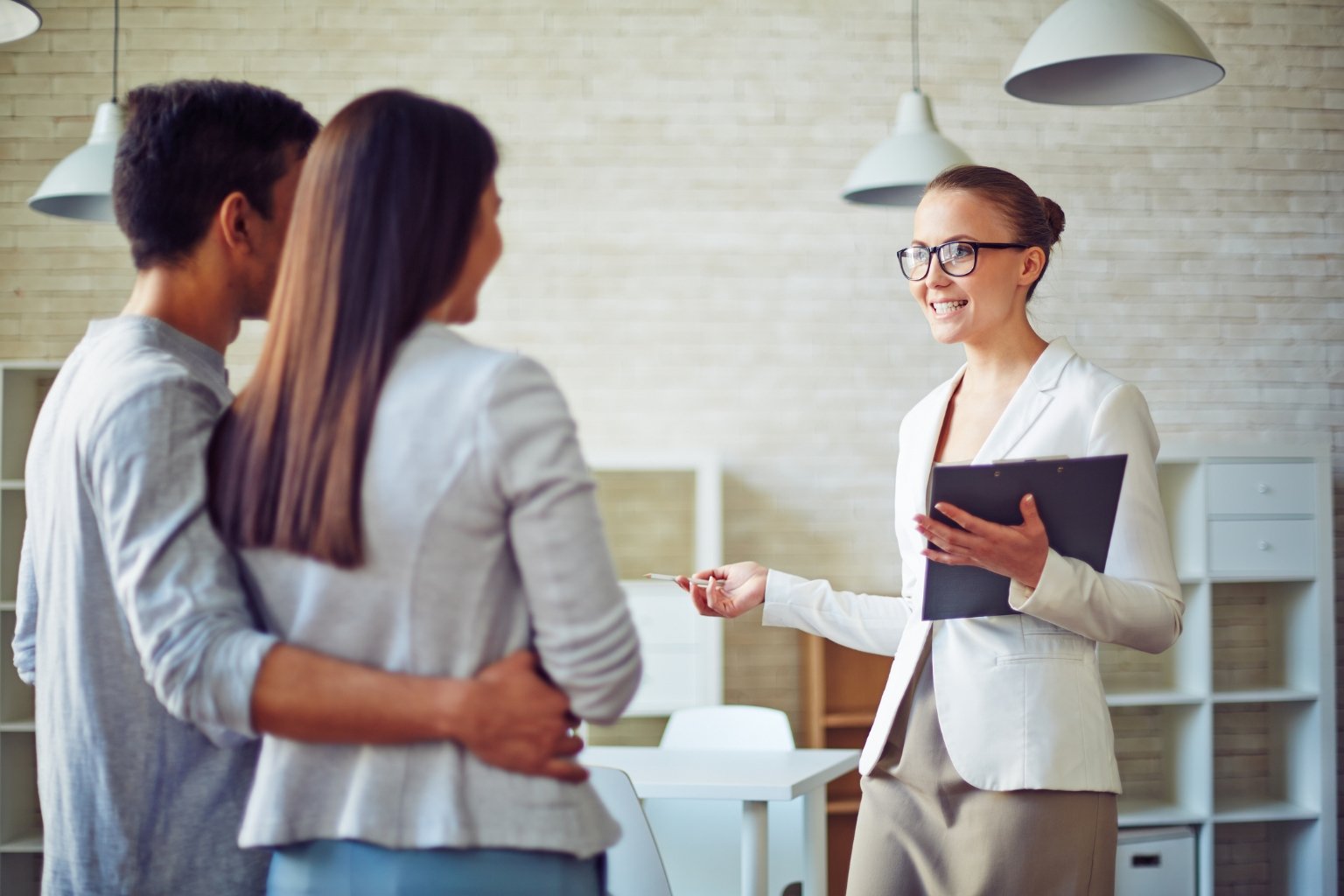 Homebuyers discussing real estate goals with an Orinda agent