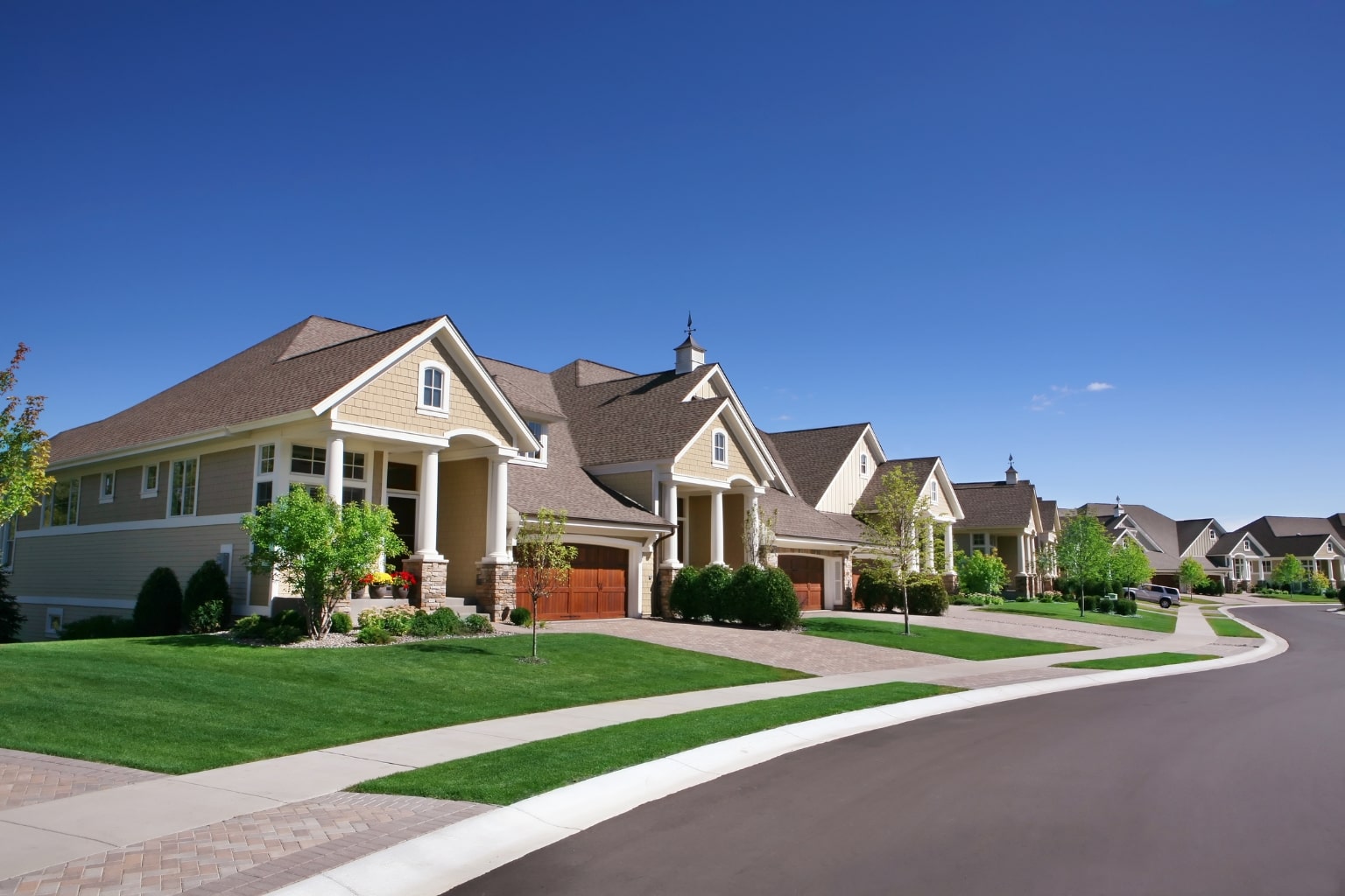 family-friendly street with various house styles and trees