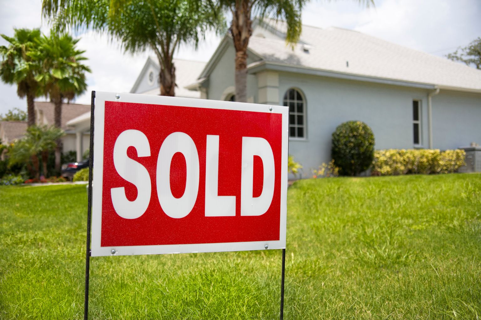 Sold sign in front of a home