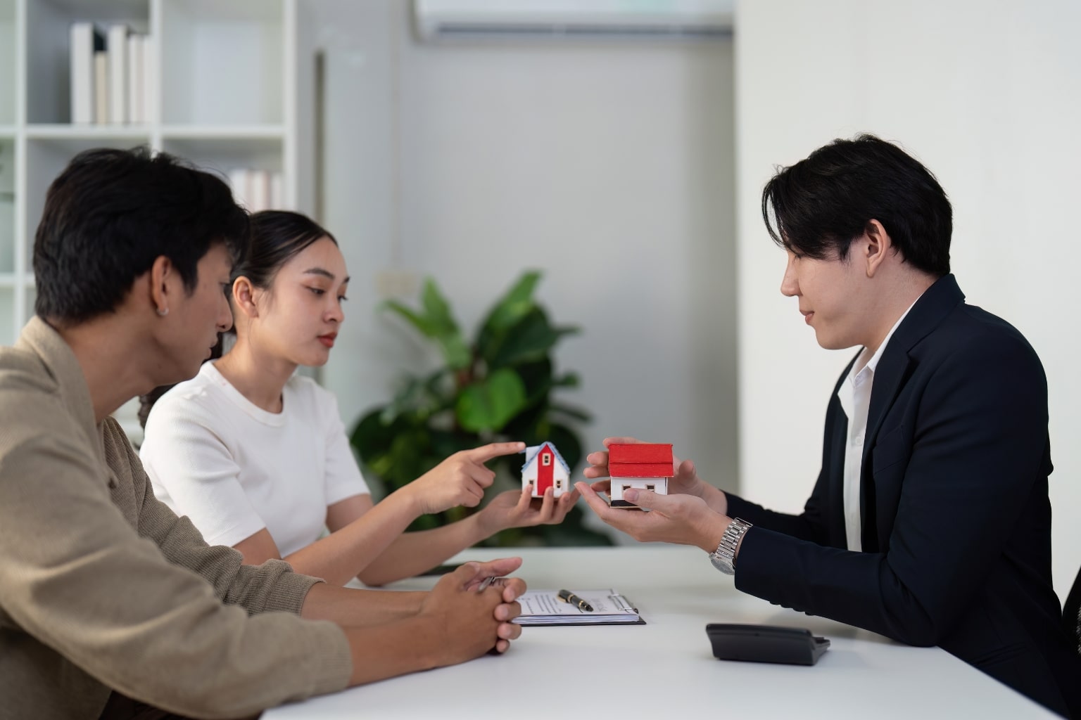 Real estate agent advising home buyers