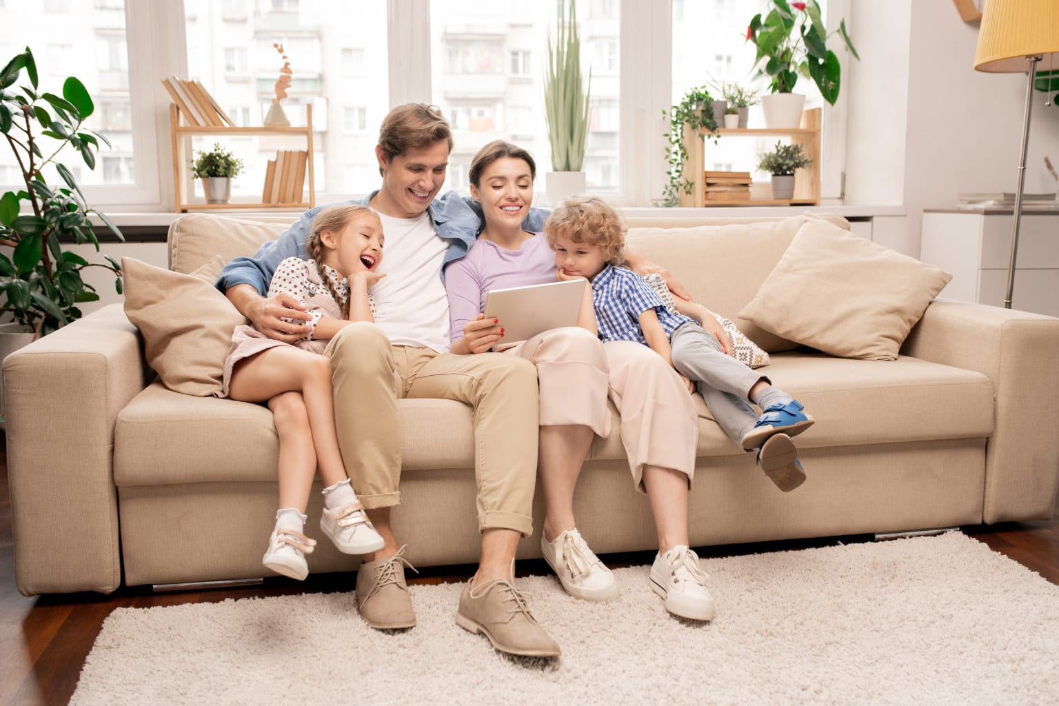 Happy family relaxing in a bright living room